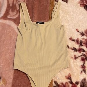 Brand new beige bodysuit from forever 21. SIZE IS M/L